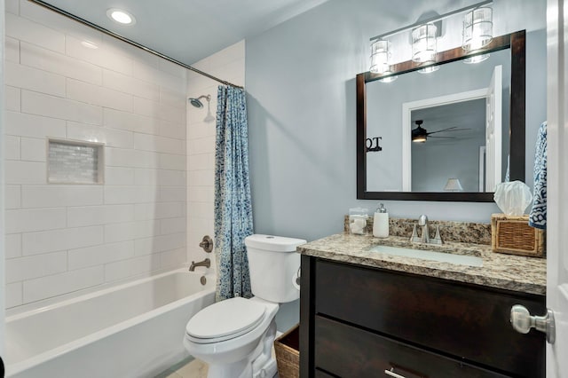 full bathroom with toilet, shower / tub combo, ceiling fan, and vanity