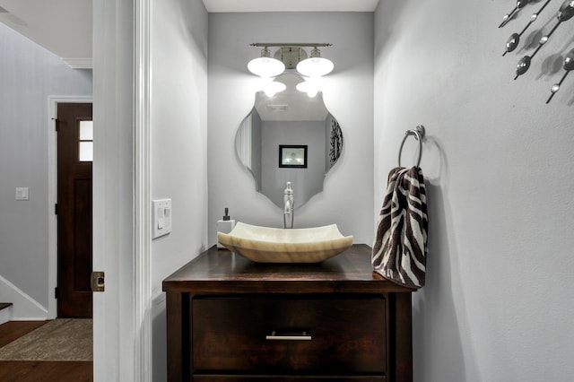 bathroom featuring vanity and wood finished floors