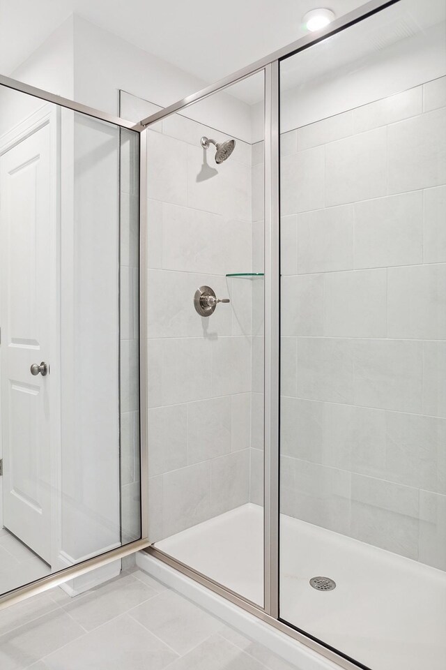 bathroom with a shower stall