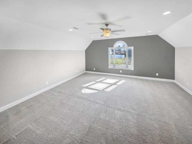 additional living space featuring lofted ceiling, baseboards, and carpet flooring