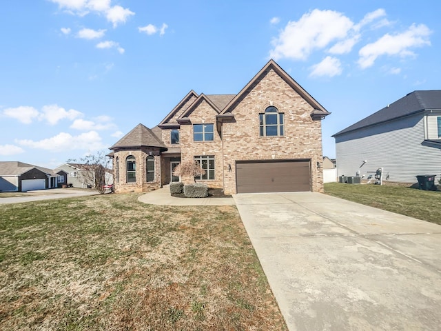 view of front facade with driveway, a garage, a front lawn, and brick siding