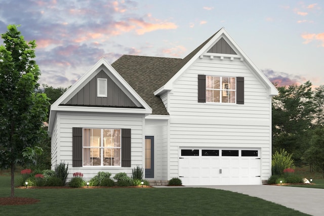 view of front of property featuring an attached garage, a shingled roof, driveway, a front lawn, and board and batten siding