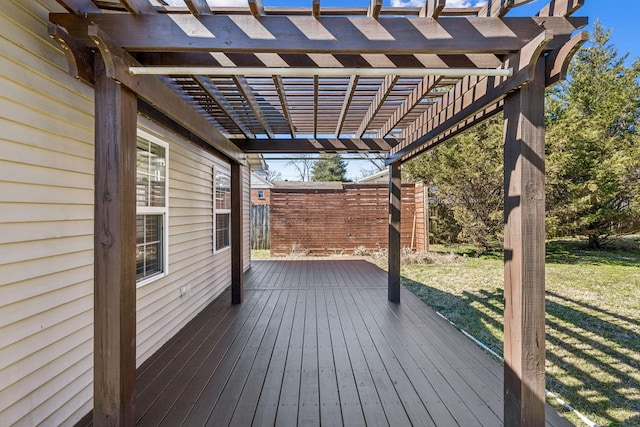 wooden terrace featuring a pergola and a yard