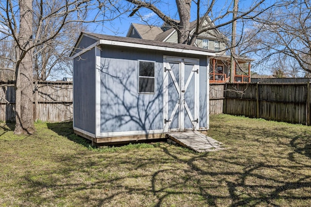 view of shed featuring a fenced backyard