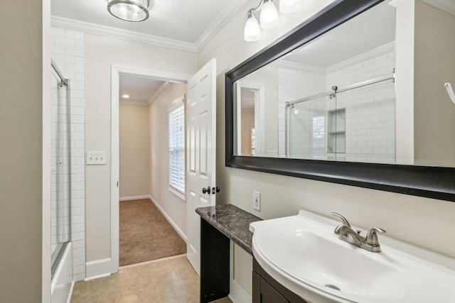 full bath with baseboards, tile patterned floors, vanity, and crown molding