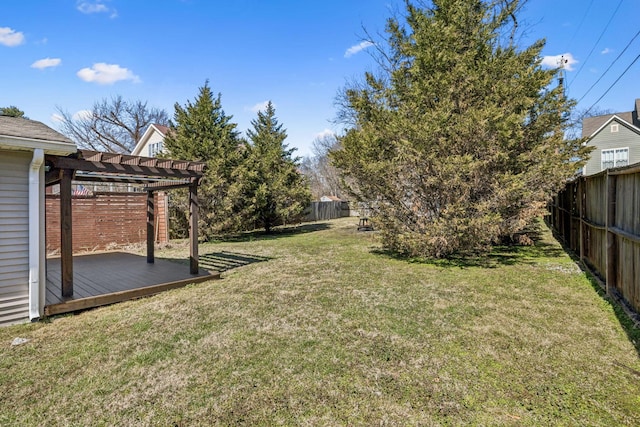 view of yard with a deck, a fenced backyard, and a pergola