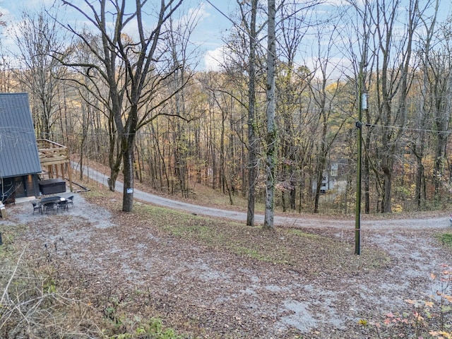 view of yard with a forest view