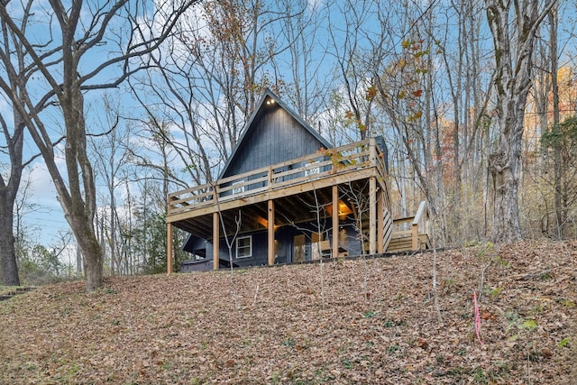 rear view of house with a wooden deck