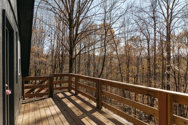 wooden deck featuring a wooded view