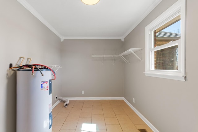 laundry room with hookup for a washing machine, water heater, ornamental molding, and baseboards