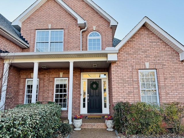 traditional-style house featuring brick siding