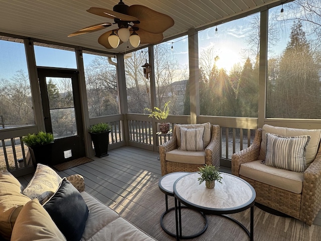 sunroom / solarium featuring wooden ceiling and ceiling fan