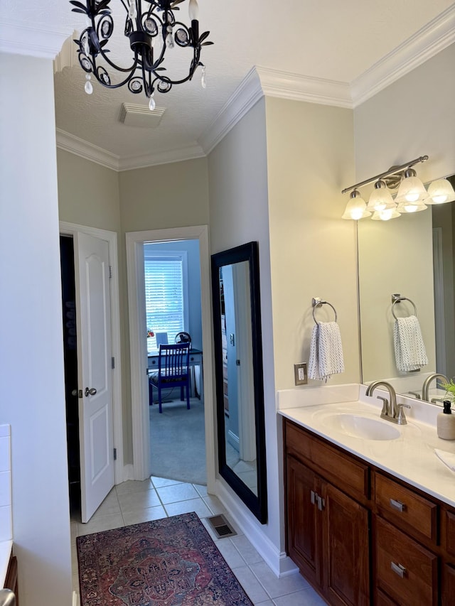 bathroom with vanity, tile patterned floors, ornamental molding, and a chandelier