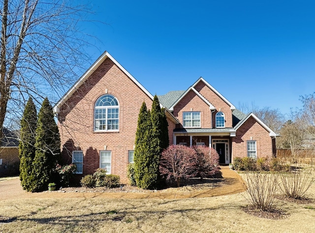 view of front of house featuring brick siding