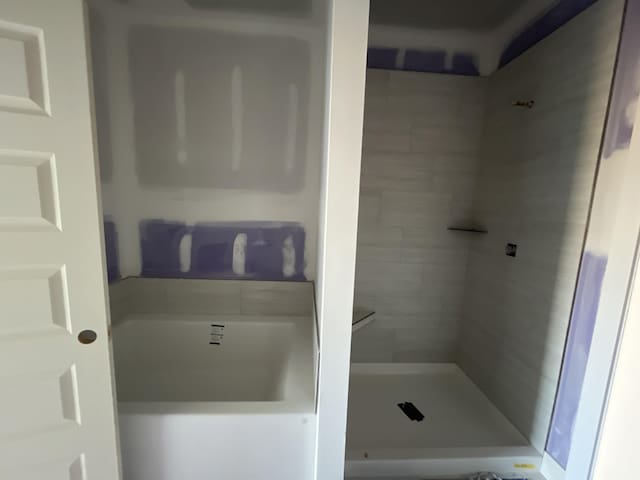 bathroom featuring a shower stall