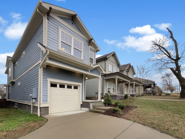 view of front of property featuring covered porch, driveway, and an attached garage