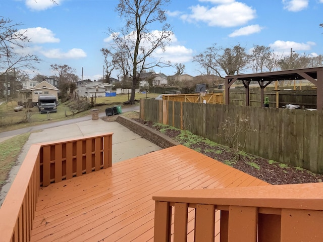 wooden terrace with fence and a residential view