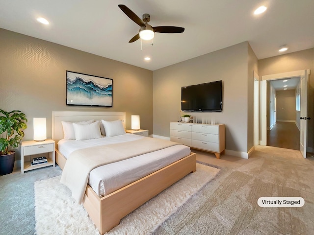 bedroom featuring light carpet, baseboards, a ceiling fan, and recessed lighting