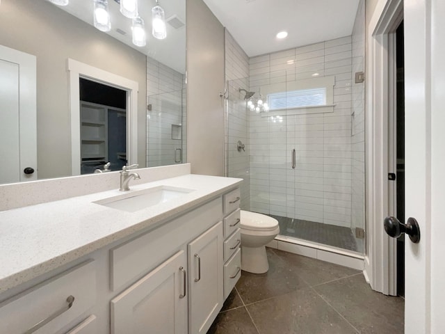 full bathroom with tile patterned flooring, a shower stall, toilet, and vanity