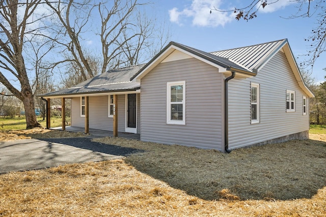 view of front of home featuring covered porch and metal roof