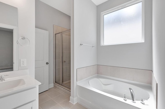 full bathroom with a stall shower, tile patterned flooring, a bath, and vanity