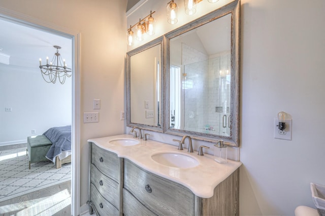 full bath with double vanity, a stall shower, a sink, and a notable chandelier