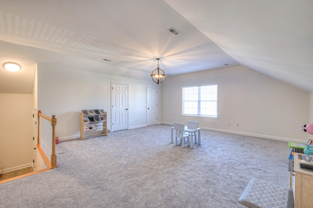 recreation room featuring lofted ceiling, baseboards, visible vents, and carpet flooring