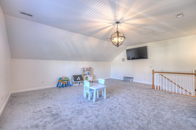 game room featuring lofted ceiling, baseboards, visible vents, and a chandelier