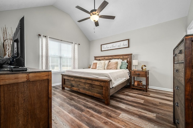 bedroom with lofted ceiling, dark wood-type flooring, and baseboards