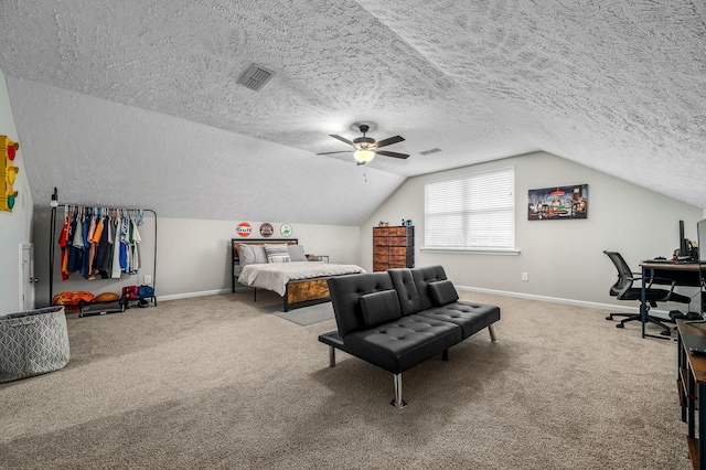 carpeted bedroom with lofted ceiling, a textured ceiling, visible vents, and baseboards