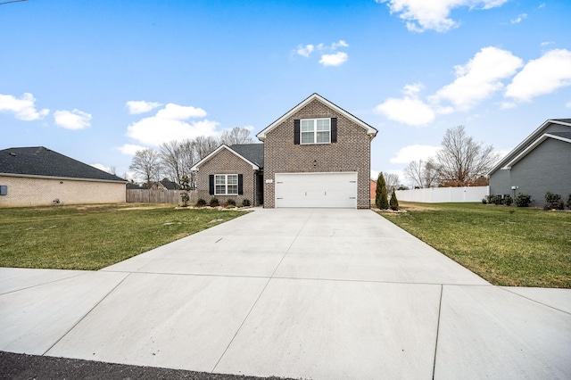 traditional-style home featuring driveway, fence, a front lawn, and brick siding