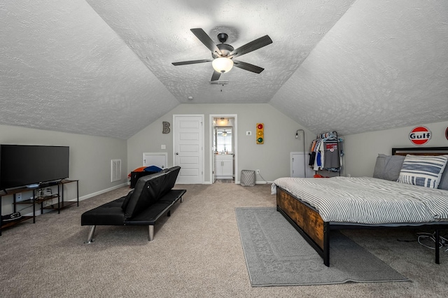 bedroom with lofted ceiling, visible vents, carpet flooring, ceiling fan, and a textured ceiling