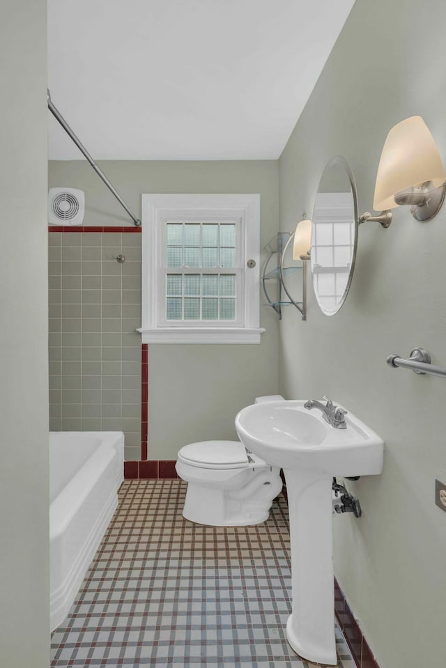 bathroom with toilet and visible vents