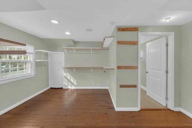 spacious closet featuring wood finished floors