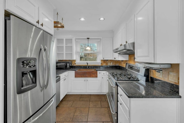 kitchen with white cabinets, appliances with stainless steel finishes, crown molding, under cabinet range hood, and a sink