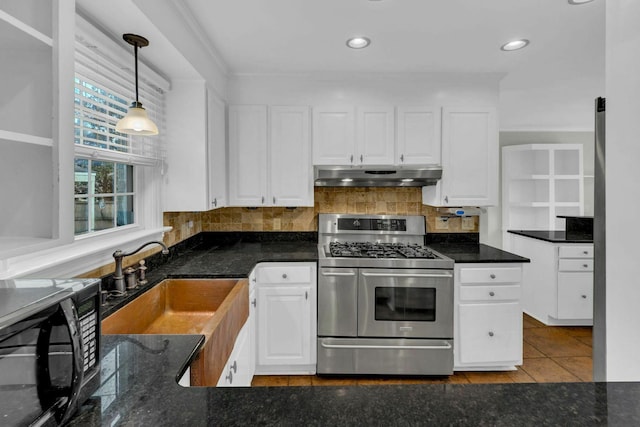 kitchen with black microwave, under cabinet range hood, double oven range, white cabinetry, and a sink