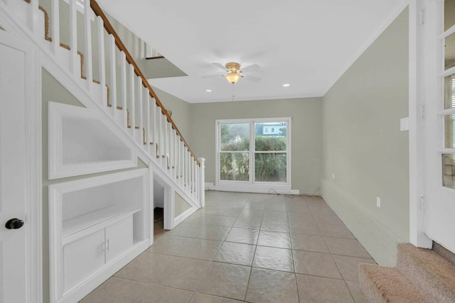 interior space with light tile patterned floors, recessed lighting, a ceiling fan, stairway, and crown molding