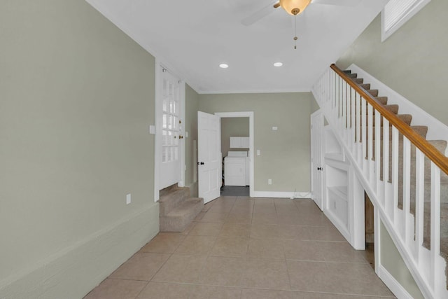 empty room featuring recessed lighting, stairway, light tile patterned flooring, and baseboards