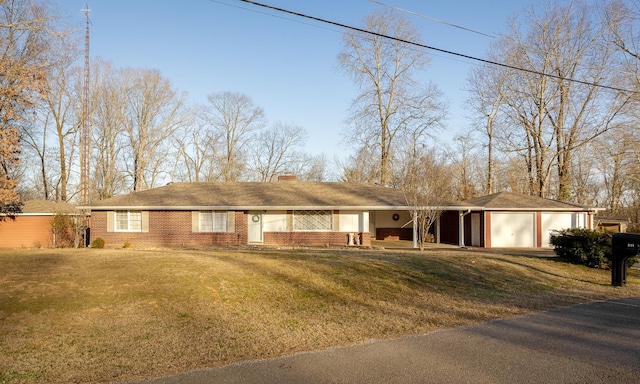 single story home with brick siding, an attached garage, a chimney, and a front lawn