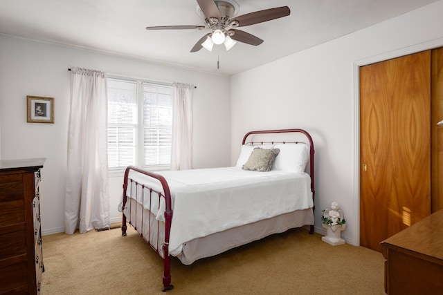 bedroom featuring carpet and a ceiling fan