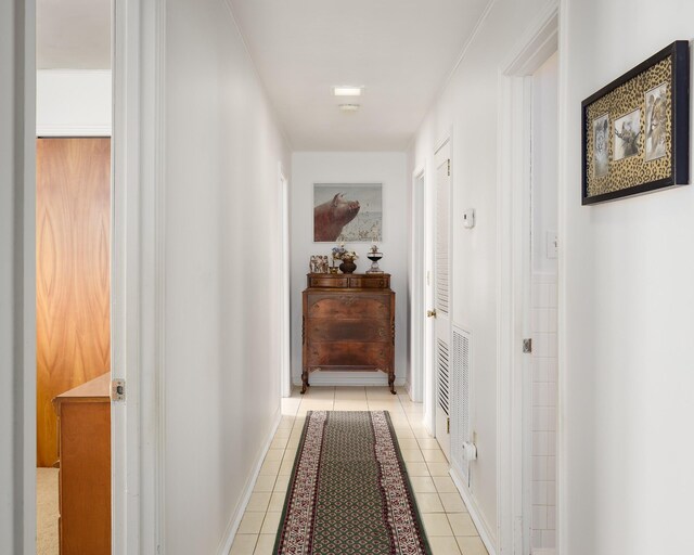 corridor with light tile patterned flooring