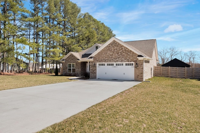 view of front facade featuring driveway, an attached garage, fence, a front lawn, and brick siding