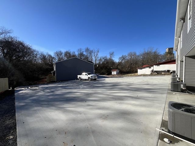 view of street featuring concrete driveway