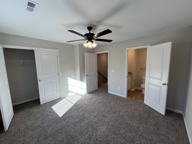 unfurnished bedroom with carpet floors, a closet, visible vents, and baseboards