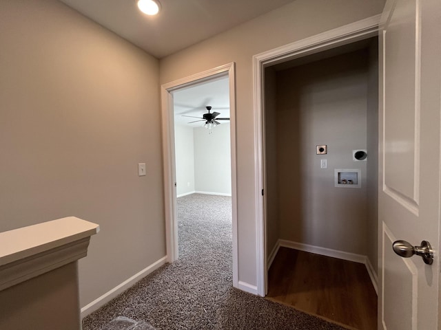 hallway with baseboards and dark carpet