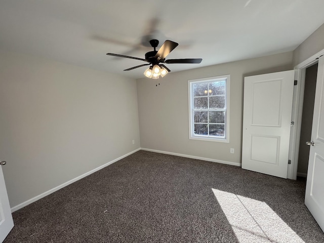 unfurnished bedroom featuring carpet floors, baseboards, and a ceiling fan