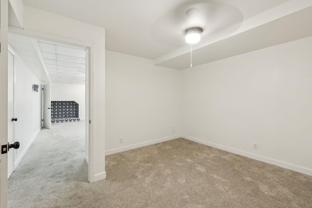 empty room featuring baseboards and carpet flooring