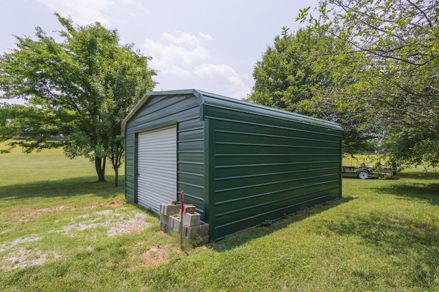 view of outbuilding featuring an outdoor structure and driveway