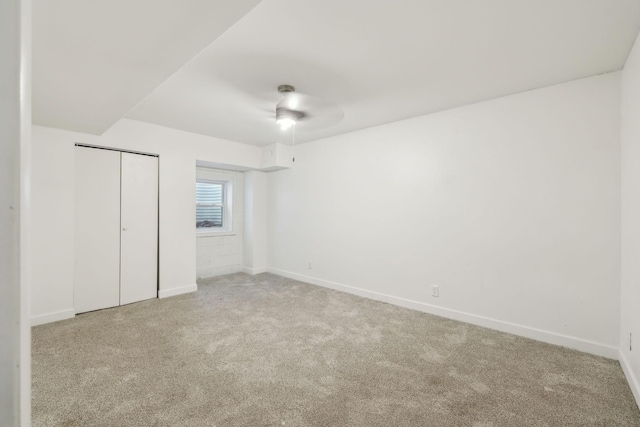 unfurnished bedroom featuring a closet, carpet, and baseboards