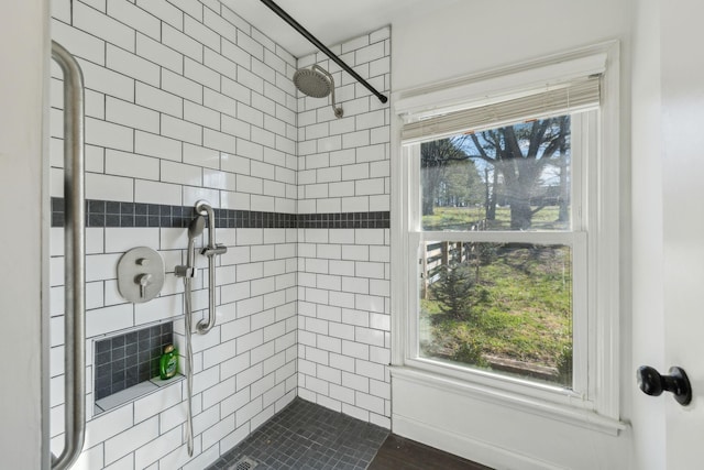 full bathroom with tiled shower